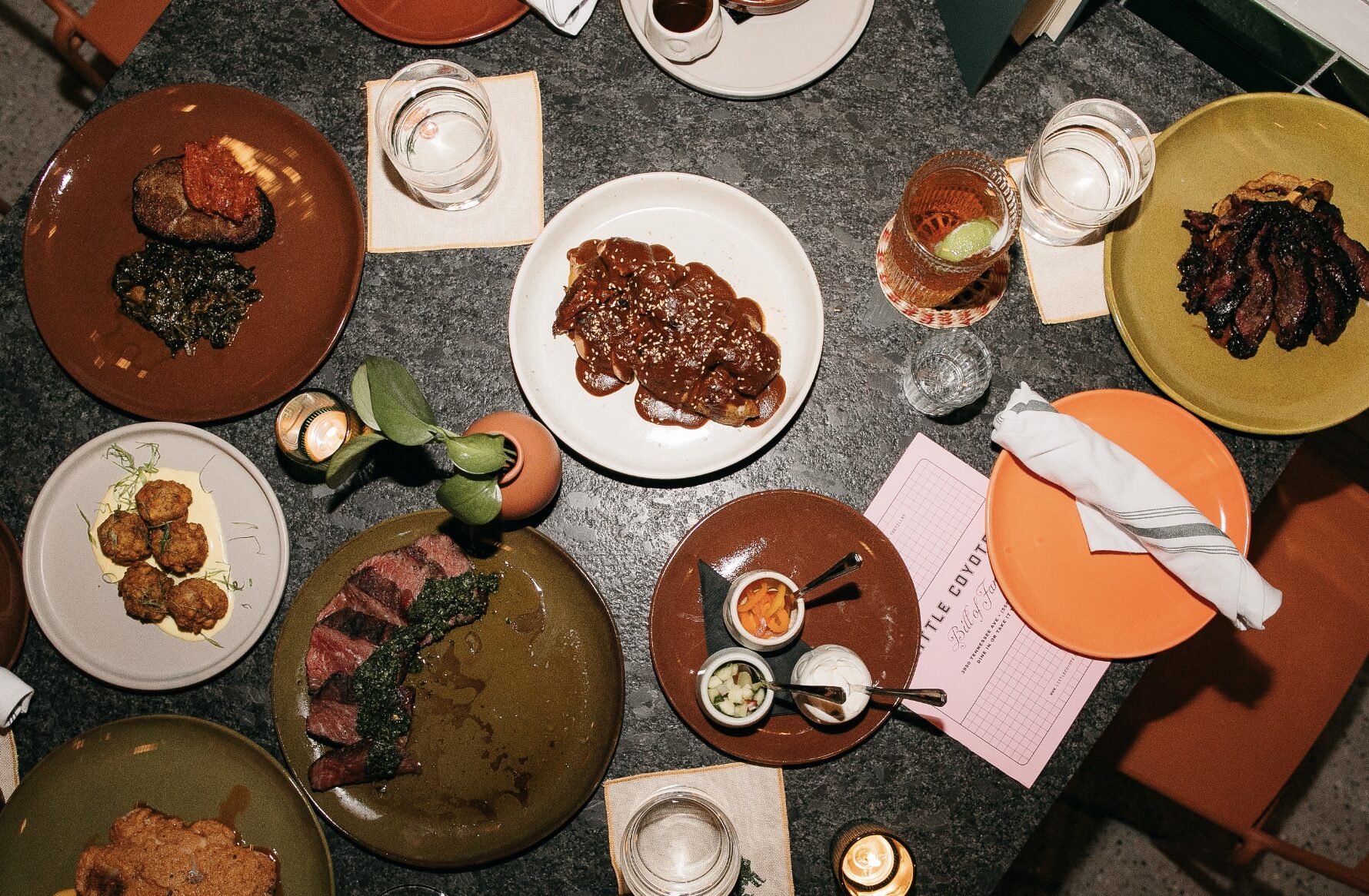 A plated dinner table of foods served at Little Coyote, one of 5 new Tennessee Restaurants